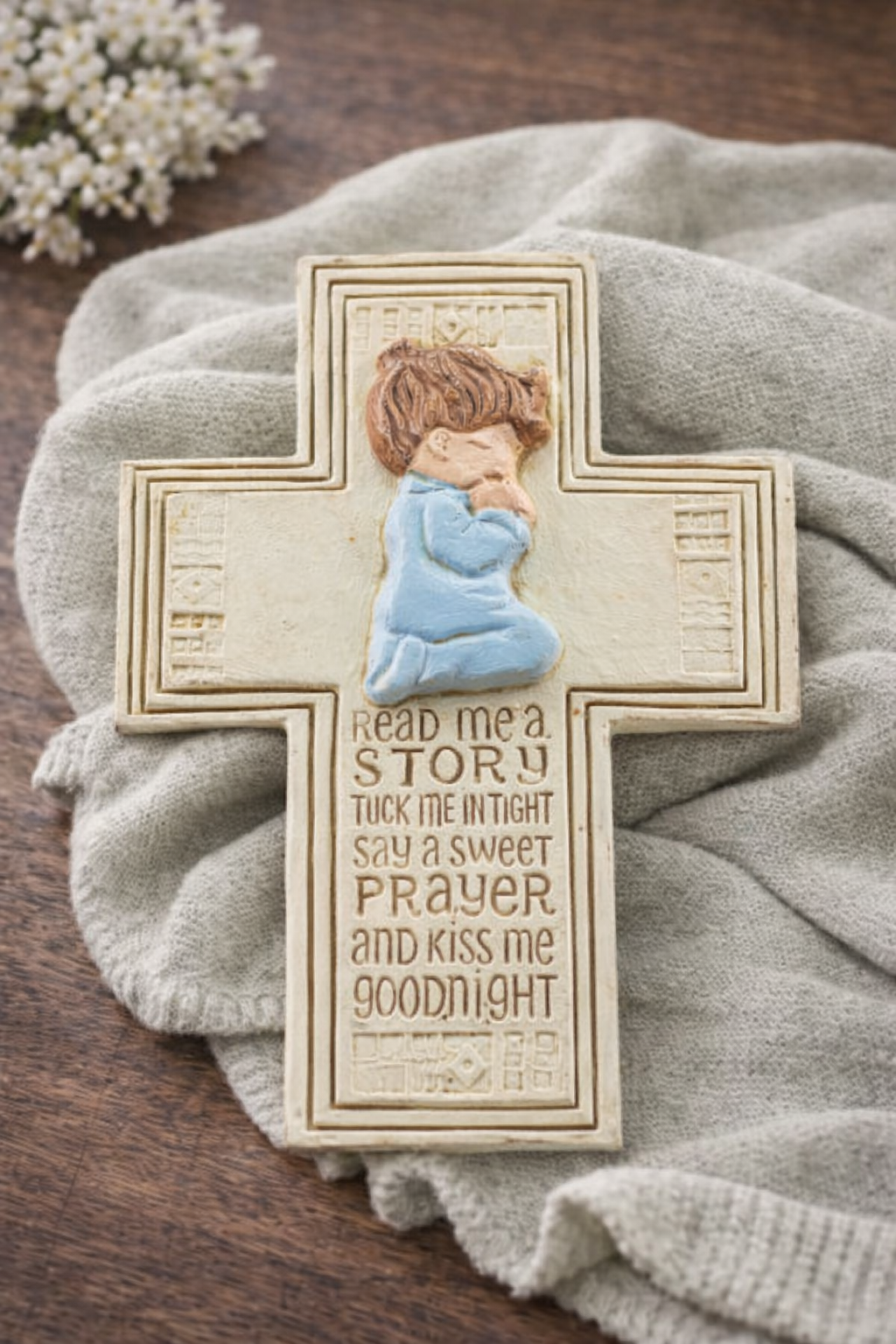boy praying cross